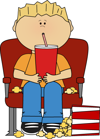 Boy_in_Movie_Theater_with_Drink_and_Popcorn